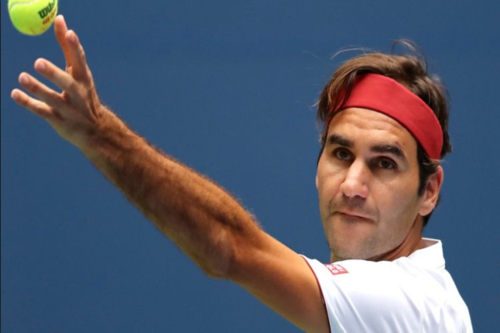 Stylish Roger Federer close up tossing ball for serve